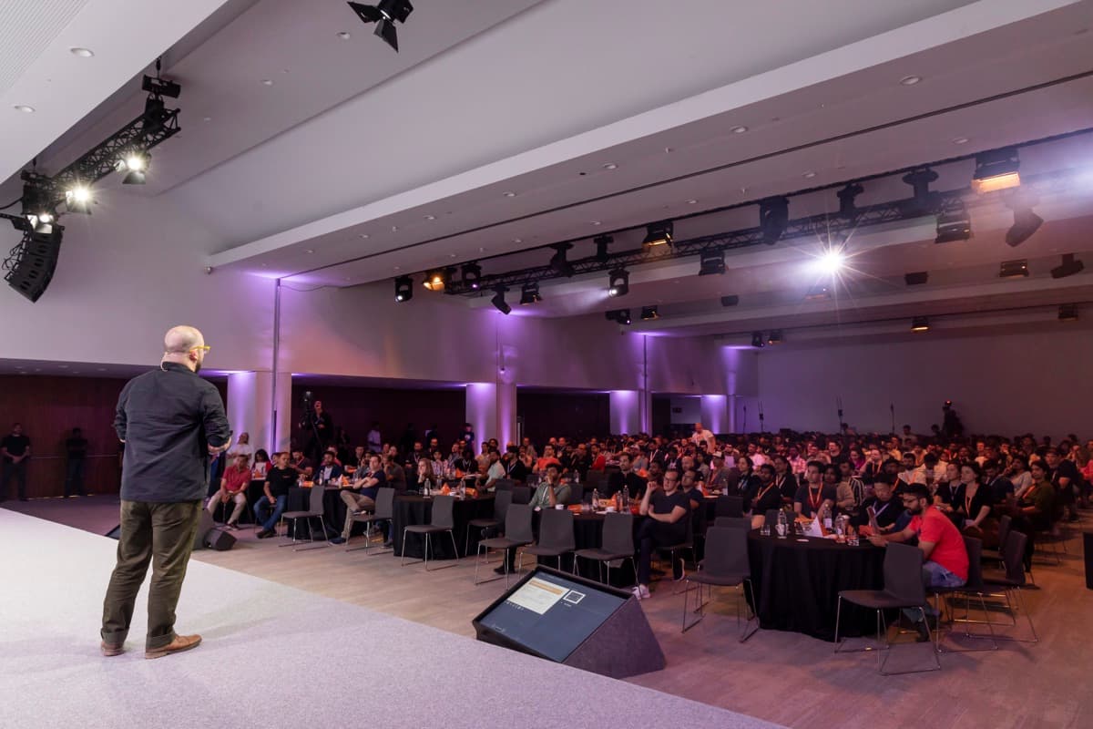 Speaking to a packed conference hall